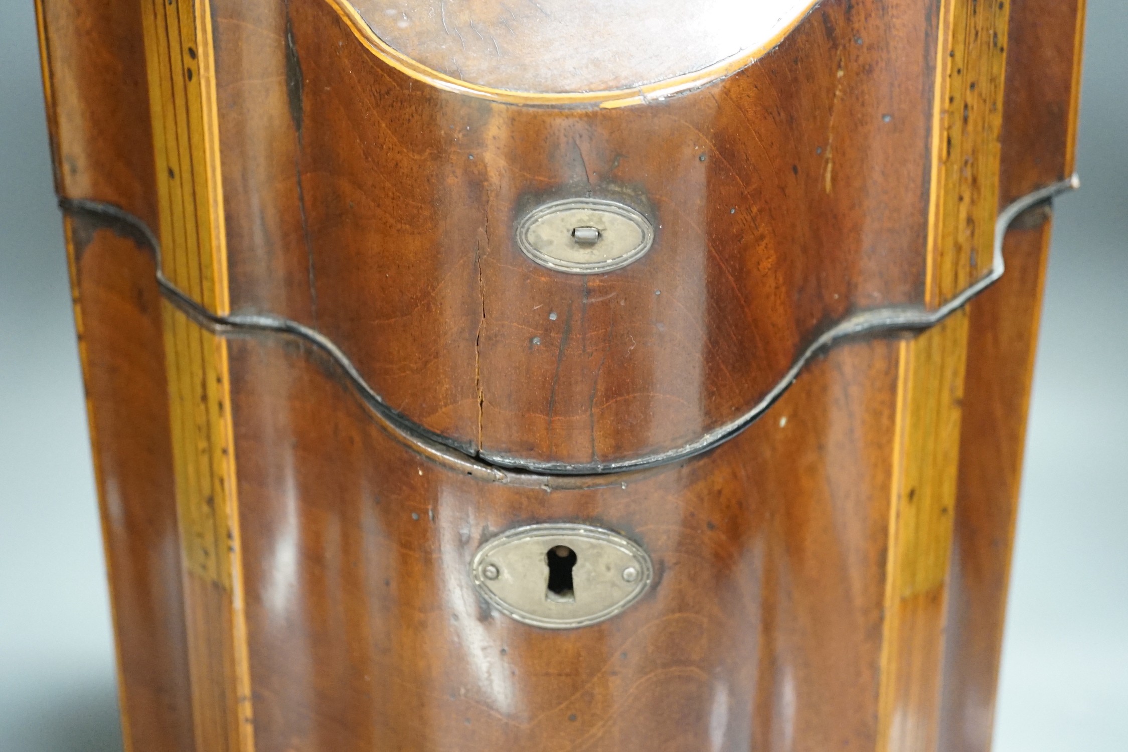 A George III mahogany knife box, with ball and claw feet, 38cms high